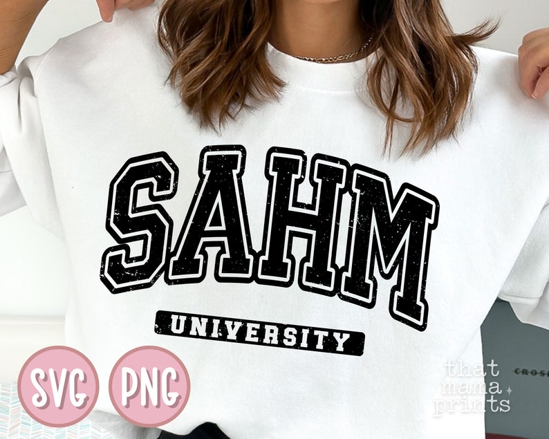 May include: White sweatshirt with black text that reads "SAHM UNIVERSITY". The text is in a distressed, vintage style font.