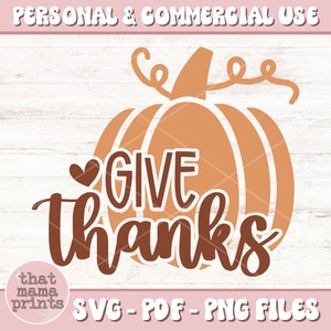 May include: A brown and orange pumpkin with a heart and the text "GIVE thanks" in brown. The image is on a white woodgrain background.