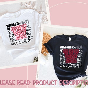 May include: Two t-shirts with a red and black leopard print "W" with the text "Wildcats" repeated around it. The shirts are white and black.