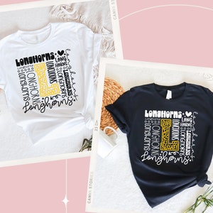 May include: Two t-shirts with a graphic design featuring the word "Longhorns" repeated in different sizes and styles. The graphic also includes a large letter "L" with a leopard print pattern. One t-shirt is white and the other is black.