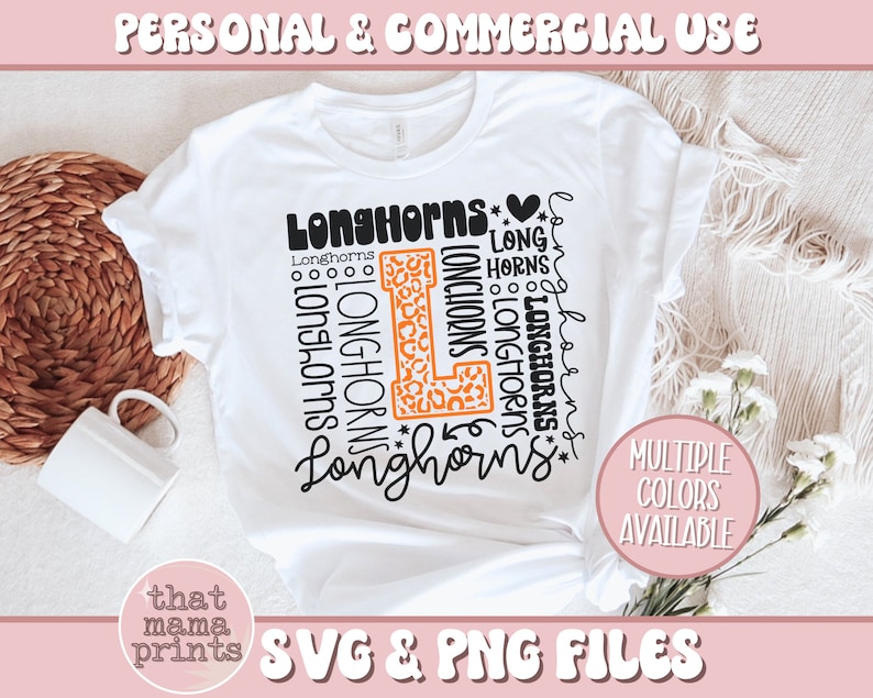May include: A white t-shirt with a black and orange design that says "Longhorns" multiple times. The design includes a large letter "L" with a leopard print pattern. The text "Multiple Colors Available" is also included on the shirt. The shirt is on a white surface with a wicker basket and white flowers.