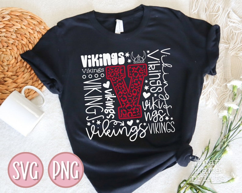 May include: Black t-shirt with a red and white leopard print "V" surrounded by the word "Vikings" in white text.