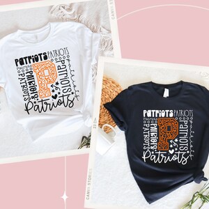 Peut inclure: Deux t-shirts avec un motif graphique repr&eacute;sentant le mot "Patriots" r&eacute;p&eacute;t&eacute; plusieurs fois et une grande lettre orange "P" avec un motif l&eacute;opard. La lettre "P" est entour&eacute;e d'&eacute;toiles et d'un c&oelig;ur.