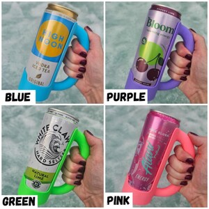 May include: Four colorful can holders in blue, purple, green, and pink. Each holder has a handle and is designed to hold a standard beverage can. The cans feature the brands High Noon, Bloom, White Claw, and Alani Nu.
