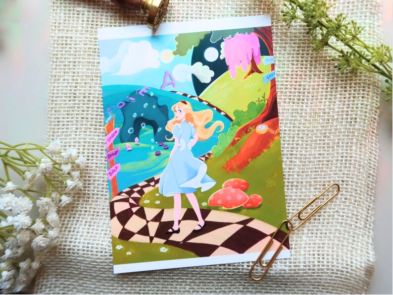 May include: A whimsical illustration of Alice from Alice in Wonderland standing on a chequered path. The background features a whimsical landscape with a cave, a tree, and a clock. The text "Drink Me" is visible on a signpost.