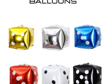 May include: Six 12-inch mini casino dice balloons in gold, silver, blue, red, white, and black. Each balloon is cube-shaped with white dot markings, perfect for a casino-themed party or event.