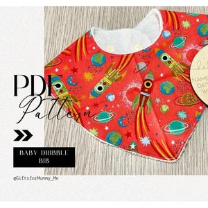 May include: A red and white baby bib with a space-themed print featuring rockets, planets, and stars. The bib is made of soft, absorbent fabric and is perfect for keeping baby's clothes clean.