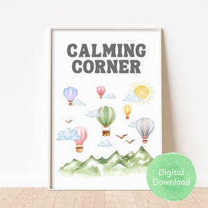 May include: A printable wall art print with the text "CALMING CORNER" in gray letters. The print features a watercolor illustration of hot air balloons, clouds, and mountains. The background is white.