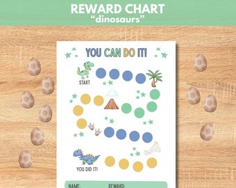 May include: A white reward chart with the text "REWARD CHART" and "dinosaurs". The chart features a path with circles, dinosaur illustrations, and the phrases "YOU CAN DO IT!" and "YOU DID IT!". Decorative dinosaur eggs surround the chart.