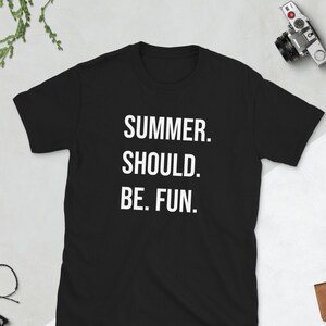 May include: Black t-shirt with white text that reads "SUMMER. SHOULD. BE. FUN."