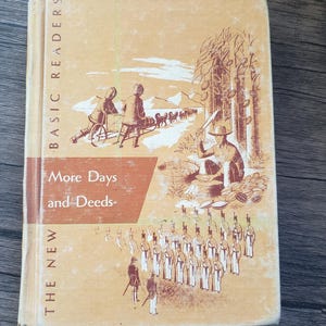 May include: Vintage book titled "More Days and Deeds" from the "Basic Readers" series. The cover features illustrations of people, trees, and soldiers. The book has a light tan cover with the title in a red-orange banner.
