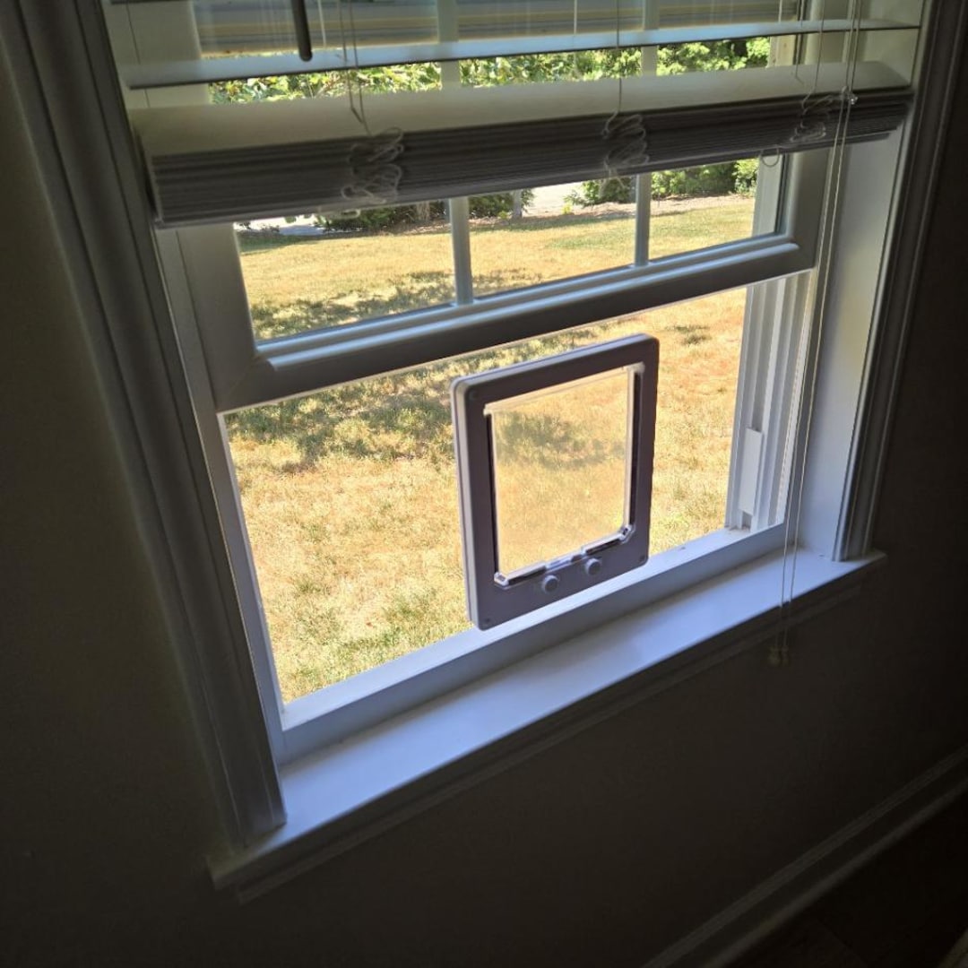 cat door installation in window frame for flush mount cat window box