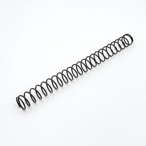 May include: A long, cylindrical metal compression spring with a black finish. The object features a consistent helical coil design with uniform spacing between each loop, extending in a straight line across the frame against a plain background.