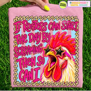 May include: A light pink t-shirt featuring a graphic of a rooster wearing star-shaped sunglasses. The text reads, "If Roosters Can Start The Day By Screaming Then So Can I." The design is enclosed in a gold scalloped border against a blue striped background.