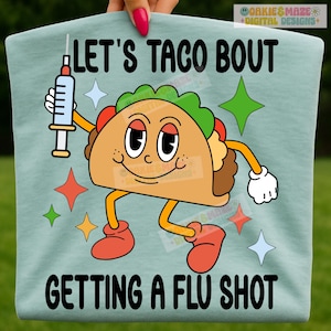 May include: A light blue t-shirt with the text "LET'S TACO BOUT GETTING A FLU SHOT". The shirt features a cartoon taco character holding a syringe, surrounded by colorful star shapes.