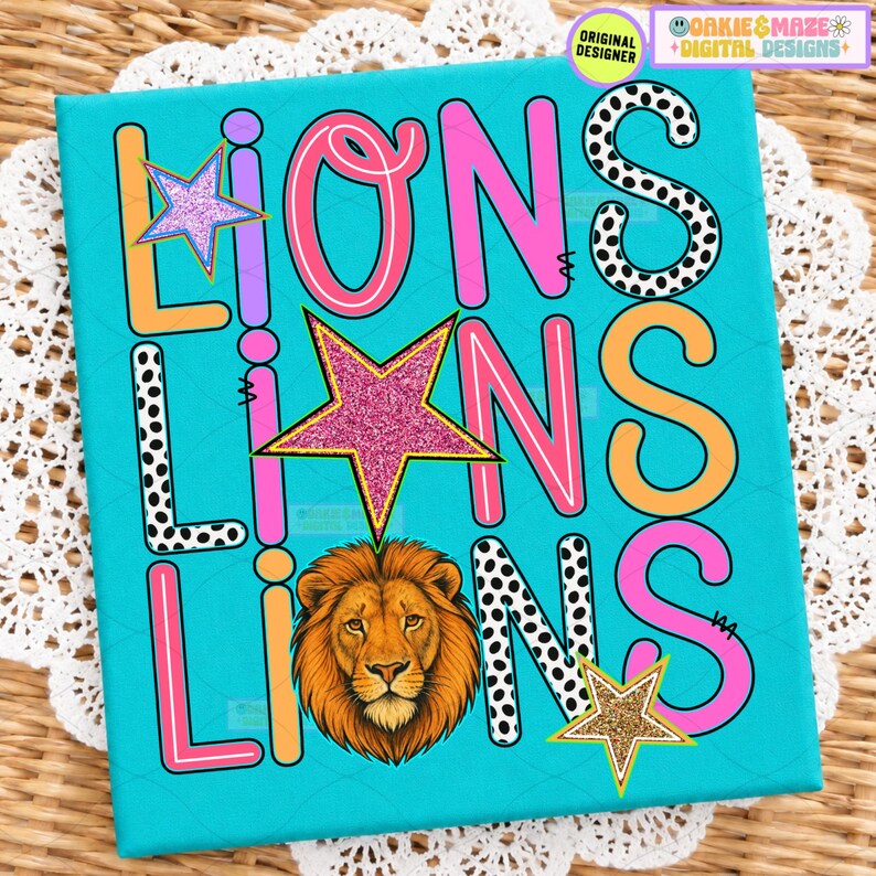 May include: A bright turquoise graphic print featuring the word LIONS repeated three times in various fonts and colors, including pink, orange, and black-and-white polka dots, accented with glittery pink and gold stars and a lion head illustration.