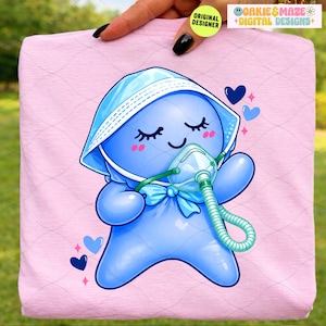 May include: A light pink t-shirt featuring a cartoon blue character wearing a blue bonnet and oxygen mask. The character has closed eyes, rosy cheeks, and a blue bow. The shirt also has blue hearts and the text "OAKIE & MAZE + DIGITAL DESIGNS + ORIGINAL DESIGNER".