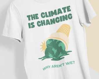 May include: White t-shirt with a graphic of the Earth melting like ice cream, with the text "THE CLIMATE IS CHANGING" and "WHY AREN'T WE?" in green. The shirt is hanging on a wooden hanger.