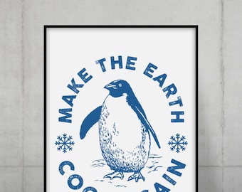Puede incluir: Impresión enmarcada con una ilustración de pingüino azul y el texto "MAKE THE EARTH COOL AGAIN". El diseño incluye copos de nieve y está sobre un fondo blanco. La impresión está en un marco negro.