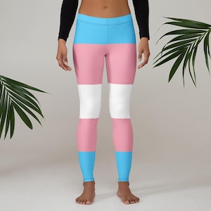 May include: A pair of blue, pink, and white striped leggings. The leggings are a representation of the transgender pride flag.