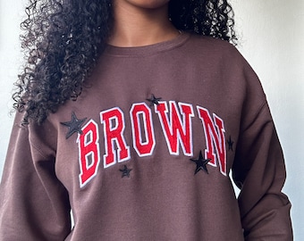 Sudadera marrón bordada unisex con cuello redondo marrón y estrellas