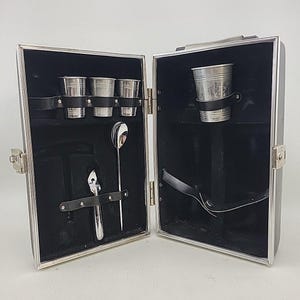 May include: A set of three ceramic mugs with a speckled, matte finish. The mugs are in shades of cream, light gray, and dark gray. Each mug has a simple, minimalist design, perfect for coffee or tea.