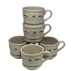 May include: A set of four off-white ceramic mugs stacked and arranged together. Each mug features a dark green horizontal line pattern and a small, centered floral-like motif. The mugs have a rounded body, a sturdy handle, and a smooth finish.
