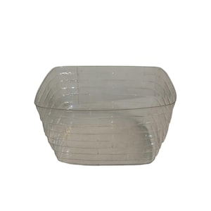 May include: A clear, rectangular plastic container with a textured, woven-like pattern. The container has a slightly curved top and a wide opening, suitable for storage or display. The transparent design allows visibility of the contents.