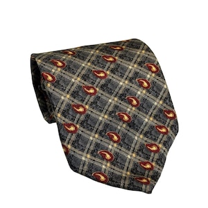 May include: A gray necktie with a plaid pattern and paisley accents in burgundy and gold. The tie is made of a woven fabric and is suitable for formal or business attire.