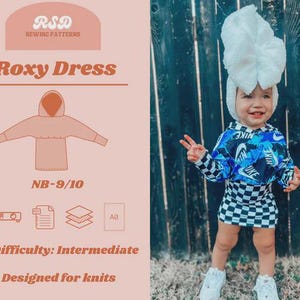 May include: A baby wearing a blue and black Nike hoodie and a black and white checkered skirt. The baby is also wearing a white hat and white shoes. The image also shows a sewing pattern for a Roxy Dress, designed for knits, with intermediate difficulty.