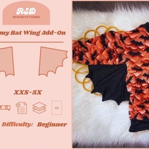 May include: A sewing pattern for a "Mommy Bat Wing Add-On" is displayed, featuring a bat wing design and the text "XXS-5X" and "Difficulty: Beginner". The image also shows a top with orange and black bat wing sleeves.