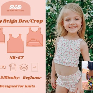 Puede incluir: Una niña pequeña con un top corto y pantalones cortos con estampado floral. La imagen también muestra un diseño de patrón de costura para un sujetador/top corto para bebé, con el texto "Baby Reign Bra/Crop" y "NB-5T". La dificultad es "Principiante" y "Designed for knits".