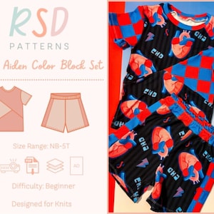 Può includere: Un set di blocchi di colore per bambini con sfondo nero e un motivo di cuori rossi e fulmini blu. Il set comprende una maglietta a maniche corte e pantaloncini. La maglietta ha maniche a scacchi rosse e blu. Il testo "RSD PATTERNS" e "Baby Aiden Color Block Set" sono visibili.