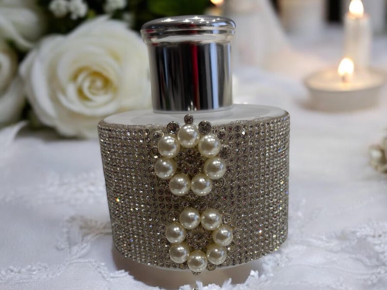 White diffuser bottle covered in rhinestones 2 circle pearl gems