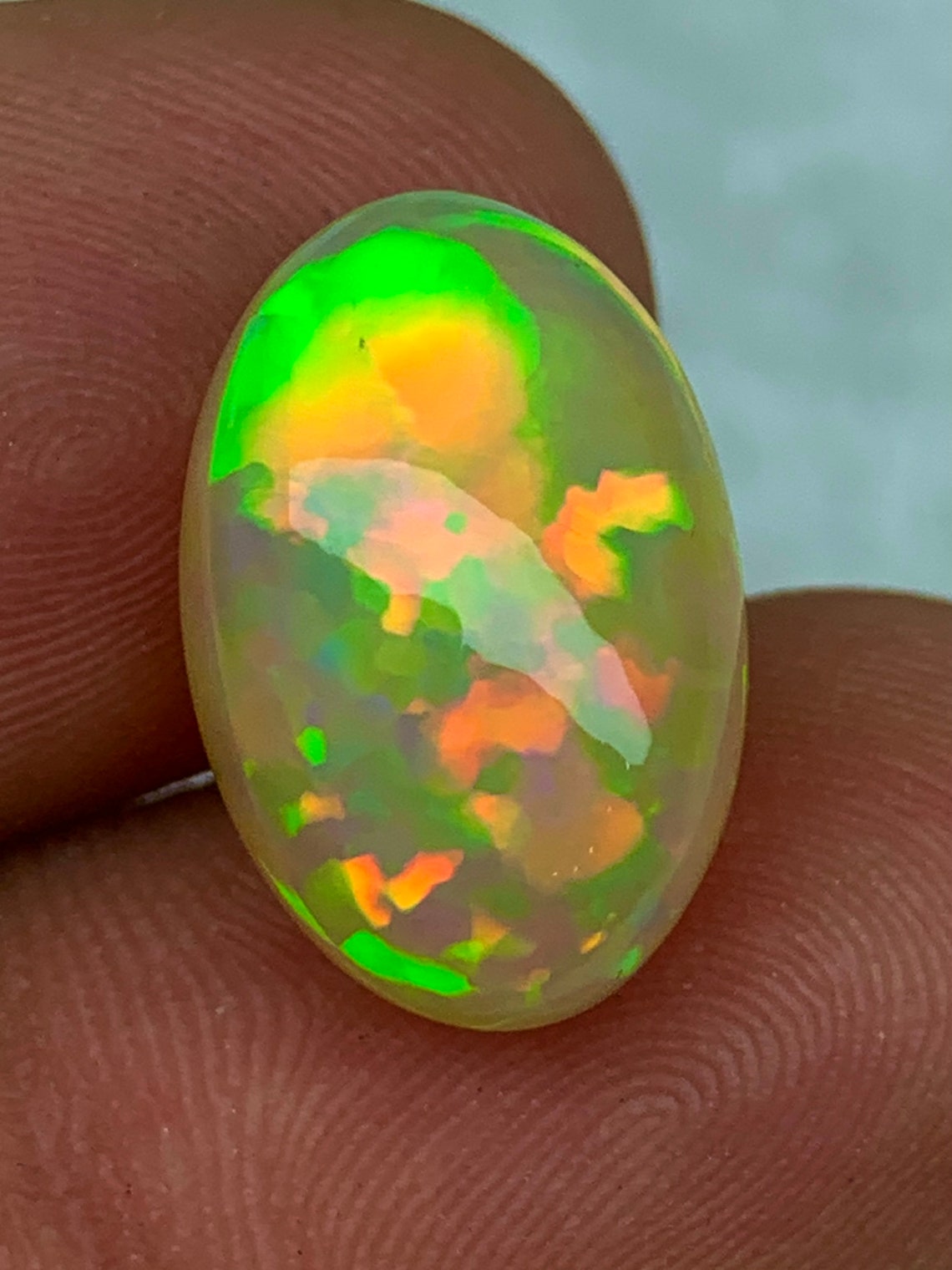8 25ct Dark Base Ethiopian Opal Golden Welo Opal Oval Cab Bright 5 5 8-25ct-dark-base-ethiopian-opal-golden-welo-opal-oval-cab-bright-5-5