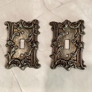 Vintage Pair of Ornate Amertac Brass Light Switch Covers