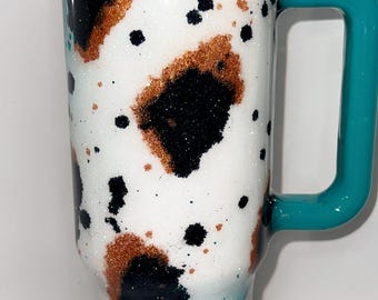 Custom tumbler  cowprint/aztec with choice of glitter and handle color.