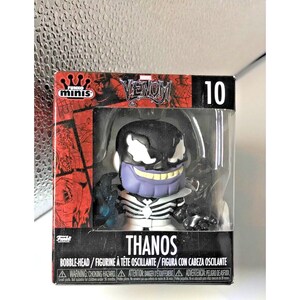 May include: A Funko Pop! Mini figure of Thanos, a bobble-head, from the Venom series. The figure has a black and white Venom mask over a purple Thanos head. The figure is in a box with the Venom logo and the number 10.