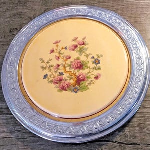 May include: A set of three ceramic vases in varying heights. The vases are white with a textured, ridged design. The tallest vase is approximately 10 inches tall, the medium vase is 8 inches, and the smallest is 6 inches.