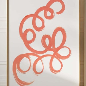 K&ouml;nnte beinhalten: Abstrakter Kunstdruck mit einem korallenfarbenen Design aus wirbelnden Linien und Schleifen auf wei&szlig;em Hintergrund. Der Druck ist in einem goldenen Rahmen gerahmt.