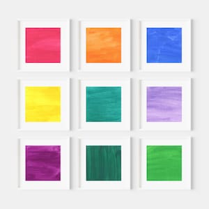 May include: Nine framed square prints of abstract watercolor paintings in various colors, including red, orange, yellow, green, blue, purple, and pink.