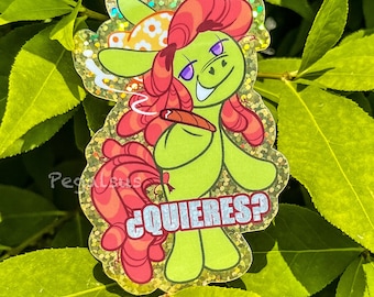 May include: A green cartoon character with red hair and a flower on its head is holding a cigar and smoking. The character is wearing a green shirt and has a white text bubble that says "¿quieres?"