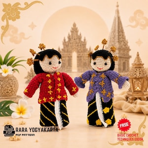 May include: Two crochet dolls featuring black hair with gold hairpieces, wearing traditional-style outfits. One doll wears a red jacket with yellow embroidery and a black skirt, while the other wears a purple jacket and a black skirt with yellow patterns.
