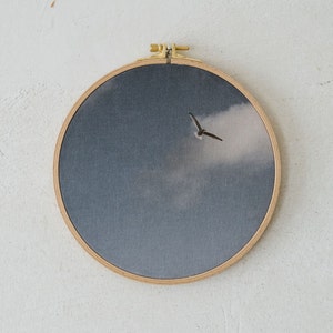 Fabric print in embroidery frame: Seagull in flight