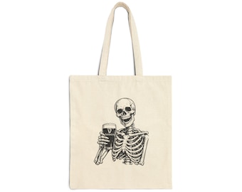 Skeleton Holding a Guinness Cotton Canvas Tote Bag
