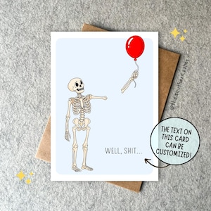 May include: A greeting card with a light blue background featuring a cartoon skeleton looking at a detached skeletal hand holding a red balloon. The text WELL, SHIT... is printed in black. A circular graphic states THE TEXT ON THIS CARD CAN BE CUSTOMIZED!