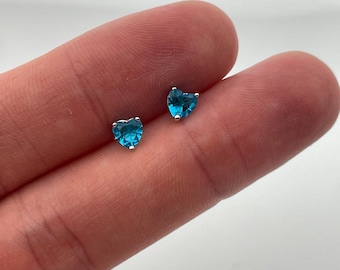 Sterling Silver Genuine Blue Topaz Heart Cut Stud Earrings