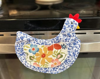 Agarrador/soporte para ollas con forma de pollo y huevo