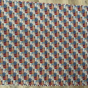 Patriotic theme lap quilt. Quilted item. Red, white, blue.