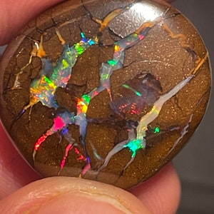 Top grade freeform boulder opal (From Queensland Australia) with awesome play of (rainbow) color 39.6 carats 21 mm x 21 mm x 9 mm